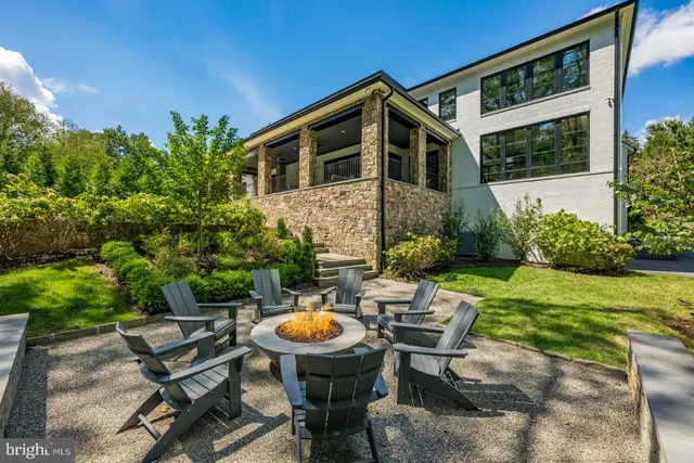 an aerial view of a house with yard swimming pool and outdoor seating