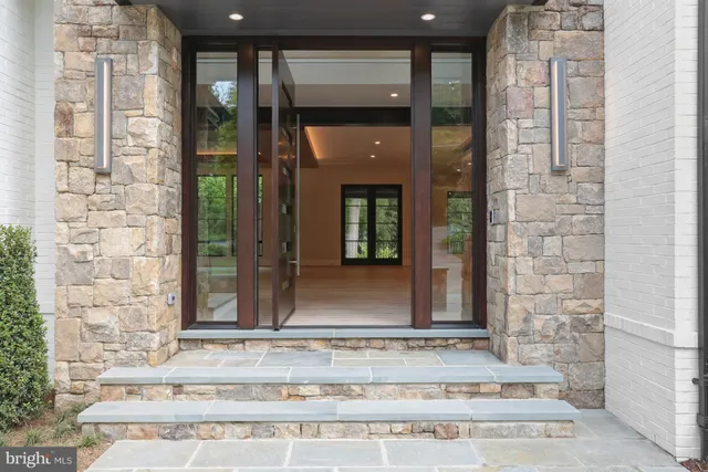 front view of a brick house with a outdoor shower