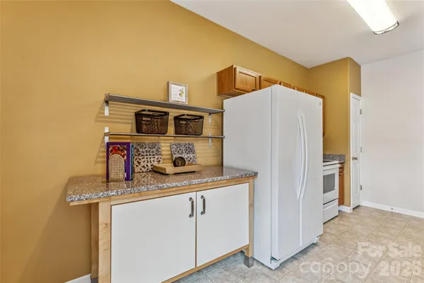 a kitchen with stainless steel appliances a refrigerator and a stove