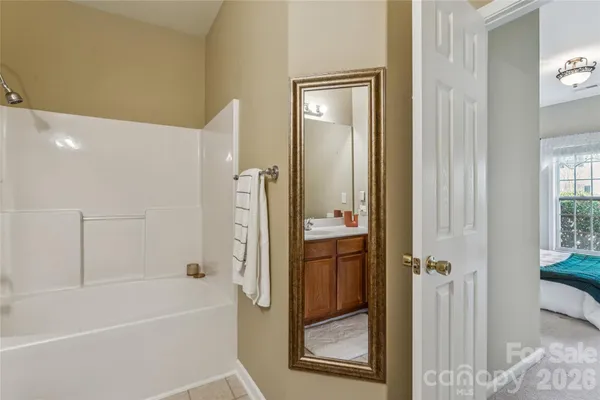 a bathroom with a bathtub and a shower