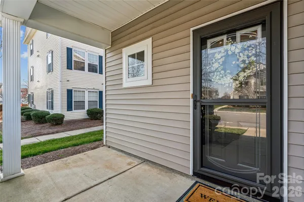 a view of a door and a window of the house