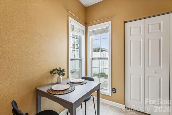 a view of a dining room with furniture and window