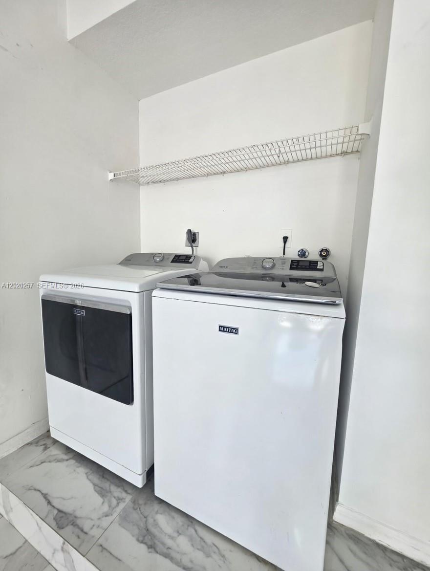 10245 Southwest 154th Place, Unit 1123 Miami, FL 33196 - Photo 29 of 38 a utility room with dryer and washer