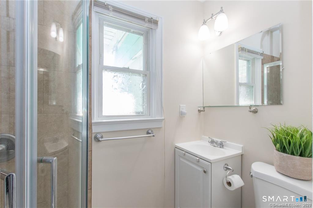 18 Lawrence Street Norwalk, CT 06854 - Photo 12 of 31 a bathroom with a sink toilet and shower