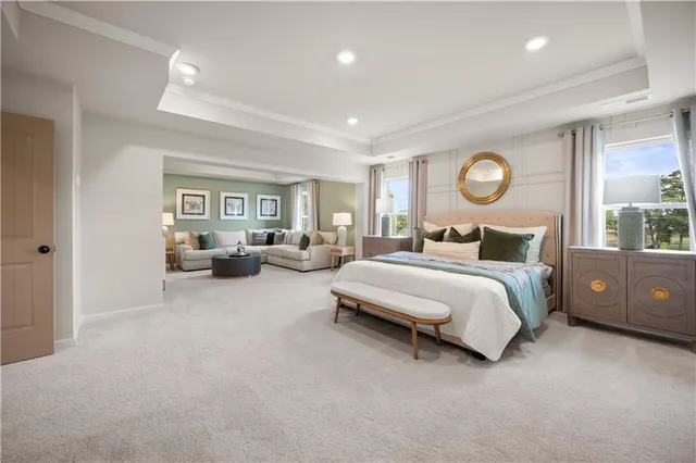 a large en suite bathroom with a tub and mirror