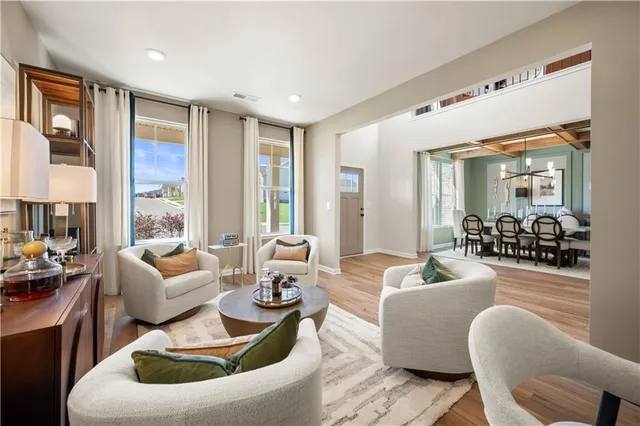 a living room with furniture or couch and a large window