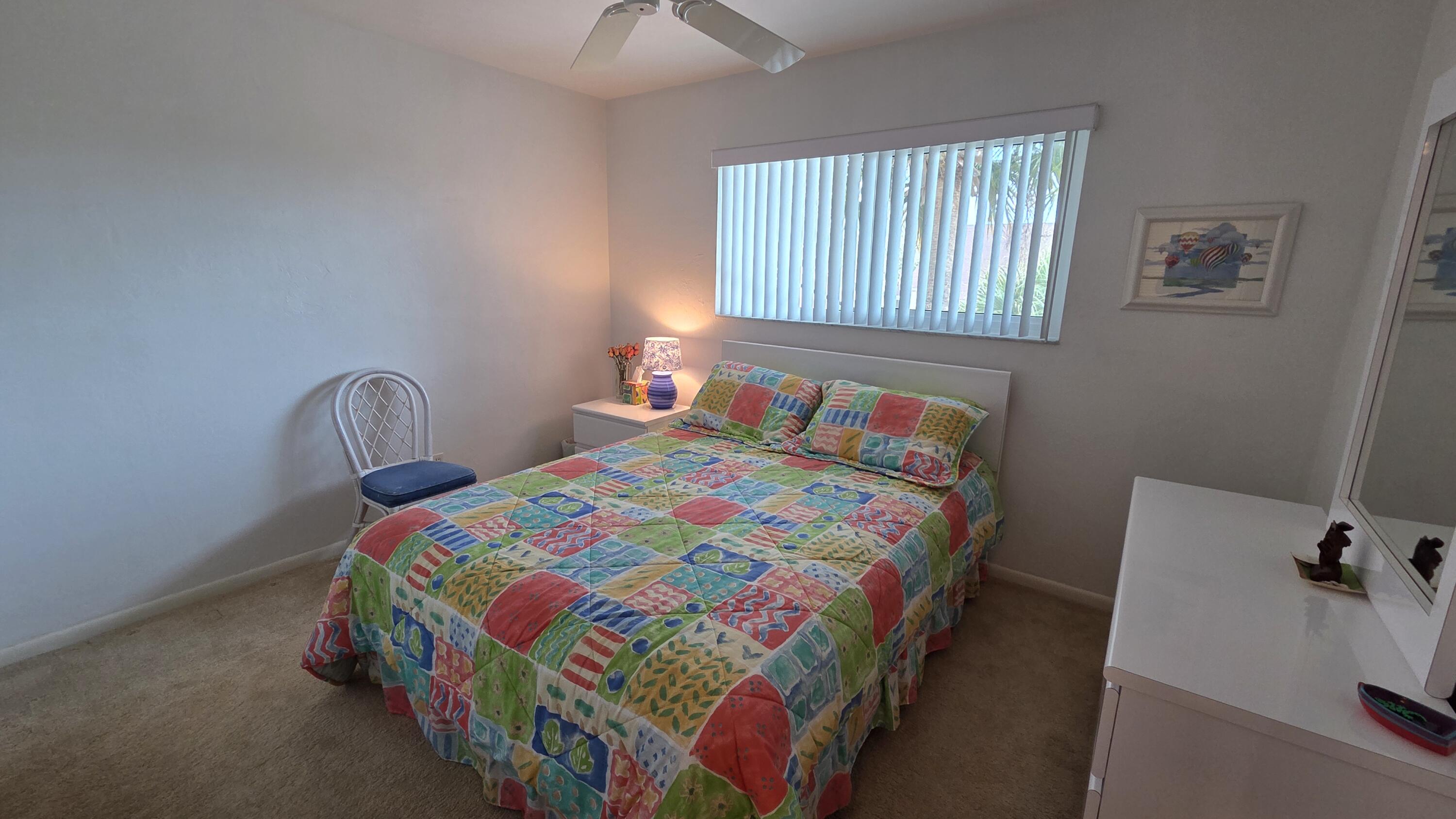 1014 Manatee Road, Unit F303 Naples, FL 34114 - Photo 11 of 22 a bedroom with a bed and a window