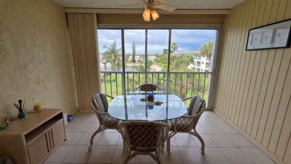 a dining room with furniture and window