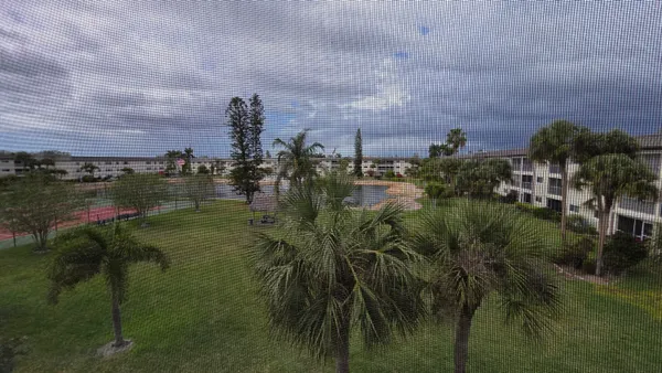 a view of a lake with a building in the background