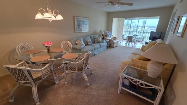 a dining room with furniture and window