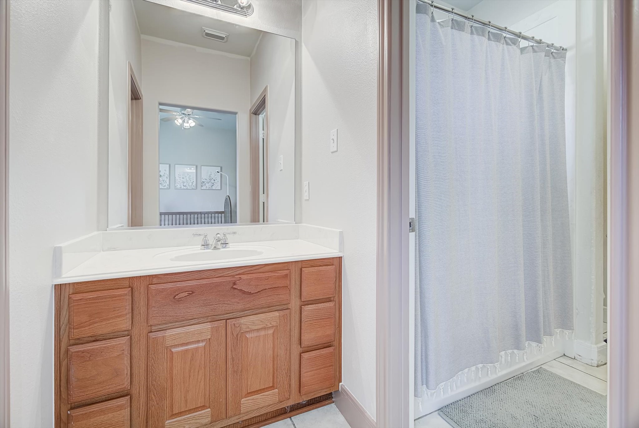 3850 Farm To Market 1010 Road Cleveland, TX 77327 - Photo 27 of 49 a bathroom with a granite countertop sink and a mirror