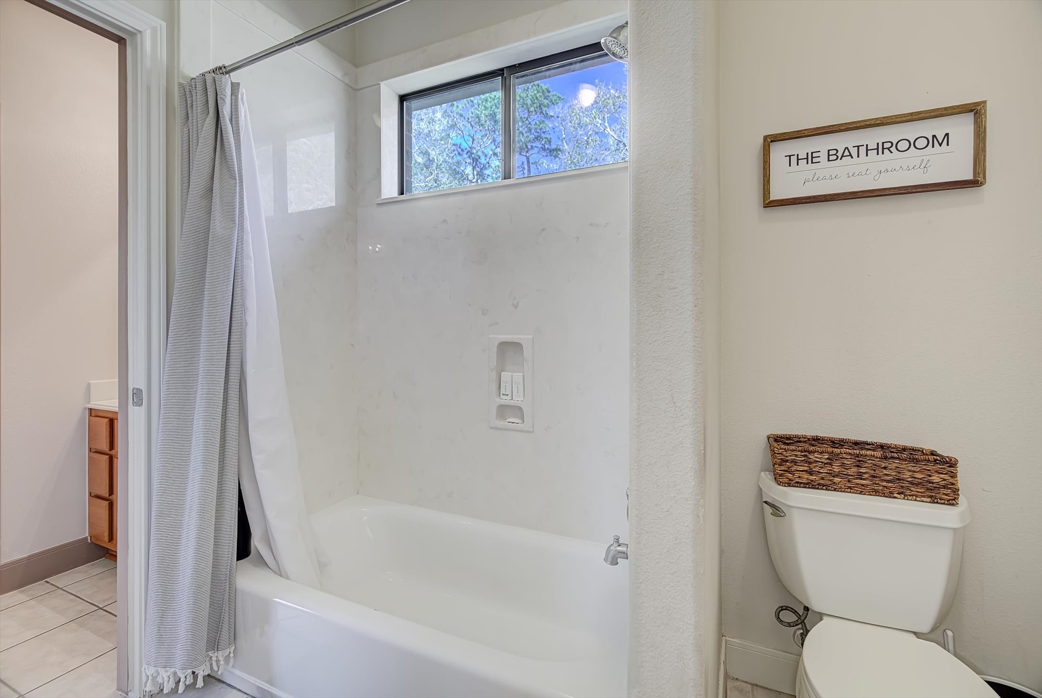 3850 Farm To Market 1010 Road Cleveland, TX 77327 - Photo 28 of 49 a white toilet sitting next to a bath tub