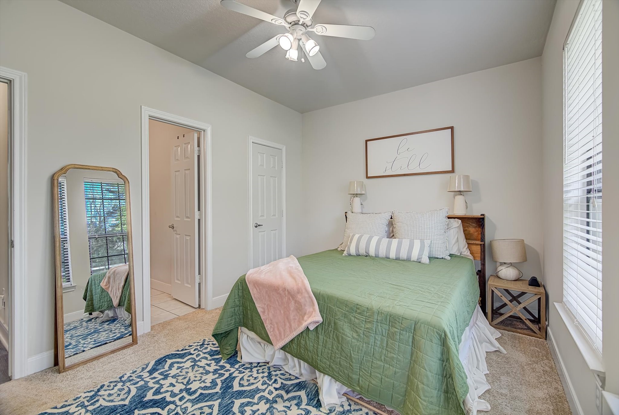3850 Farm To Market 1010 Road Cleveland, TX 77327 - Photo 30 of 49 a bedroom with a bed and a chandelier