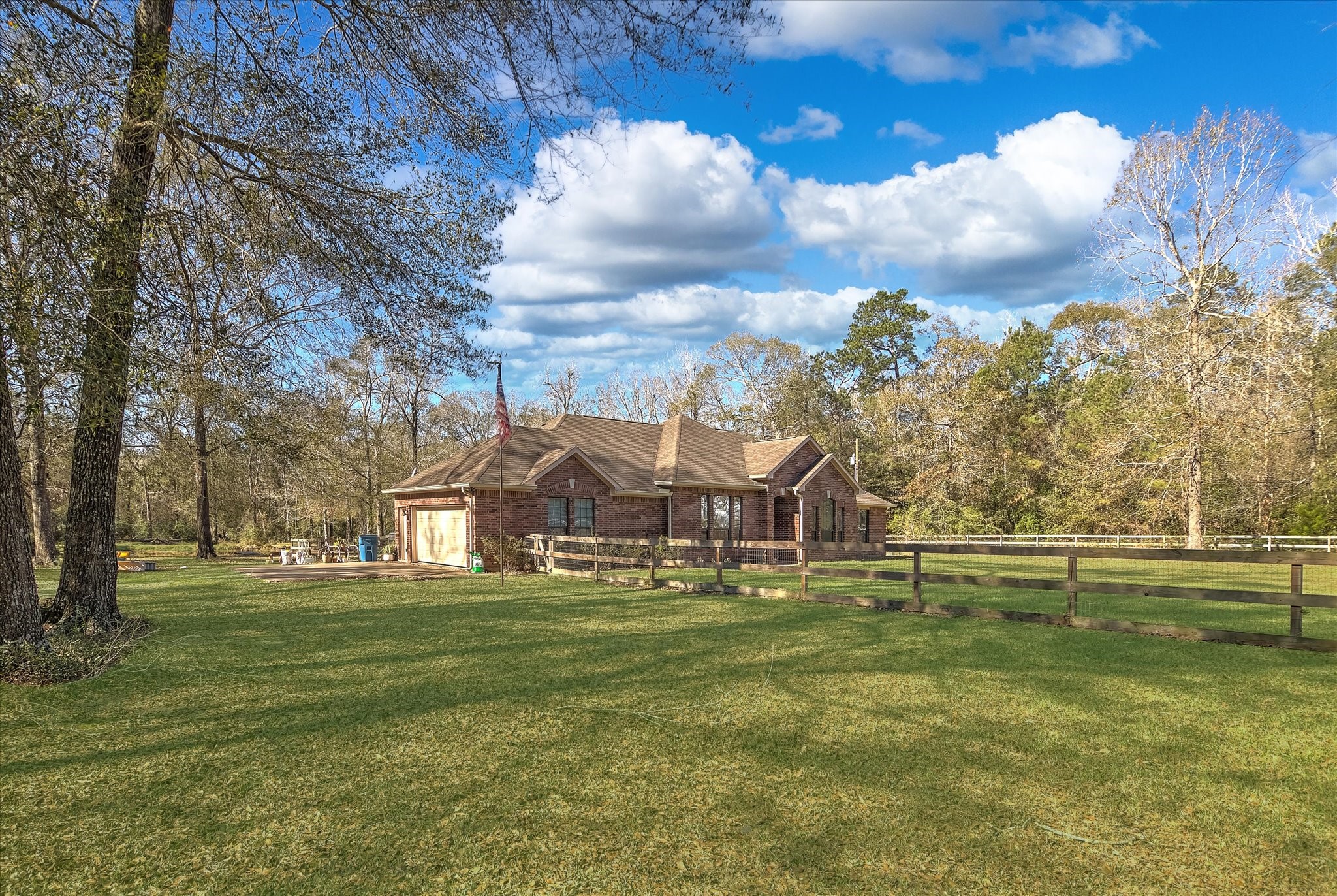 3850 Farm To Market 1010 Road Cleveland, TX 77327 - Photo 3 of 49 a view of a town with large trees