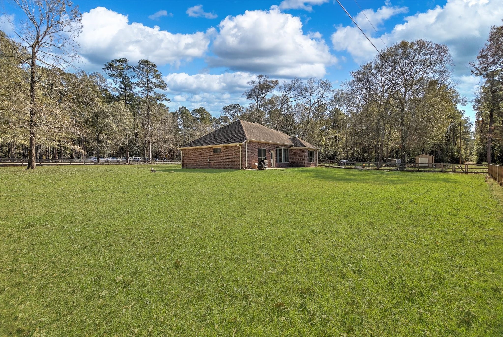 3850 Farm To Market 1010 Road Cleveland, TX 77327 - Photo 34 of 49 a view of a green field with house in the background