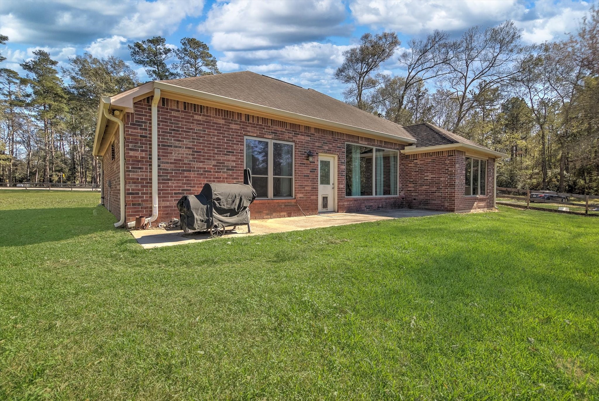 3850 Farm To Market 1010 Road Cleveland, TX 77327 - Photo 35 of 49 a view of a house with a yard