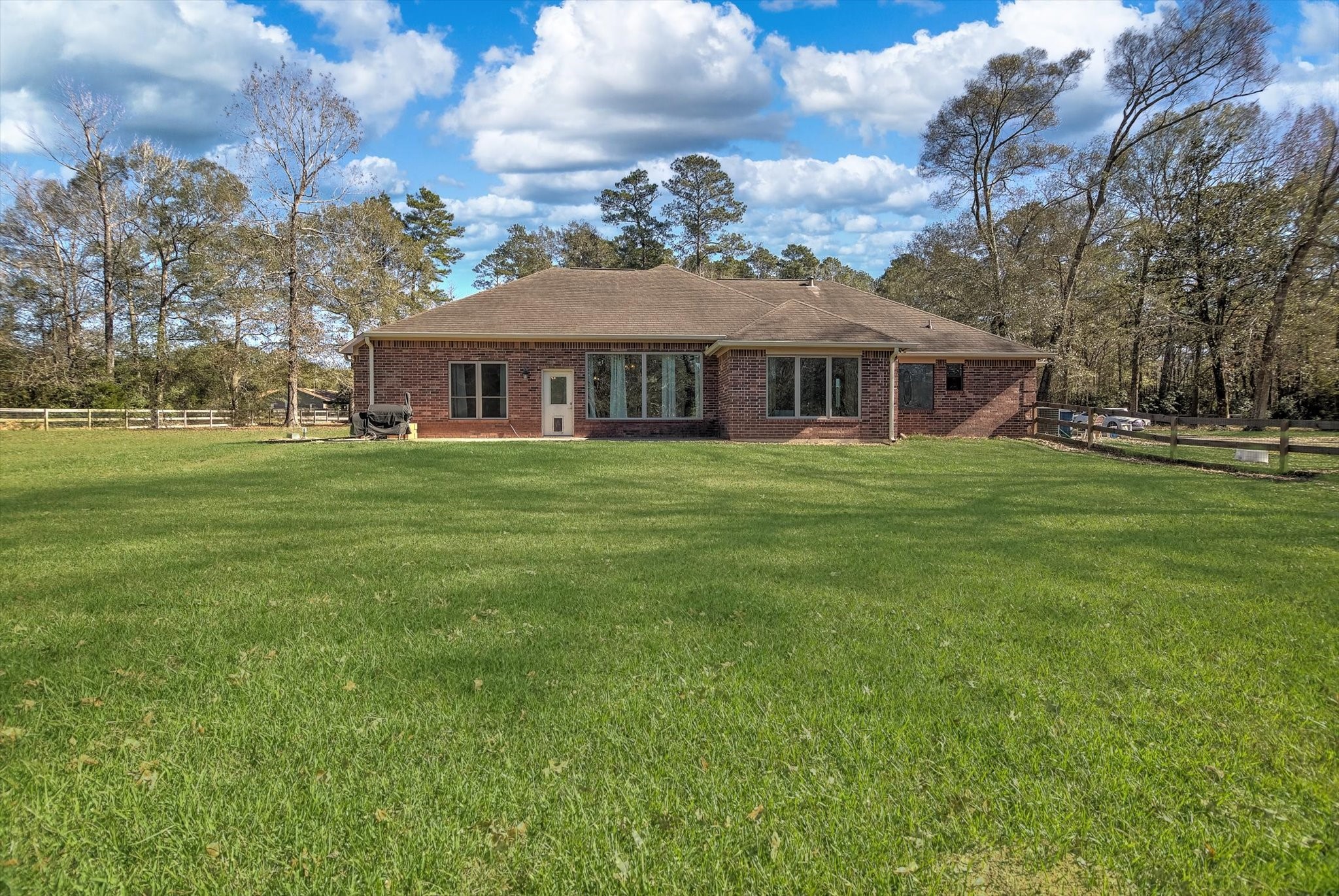 3850 Farm To Market 1010 Road Cleveland, TX 77327 - Photo 36 of 49 a front view of a house with a garden