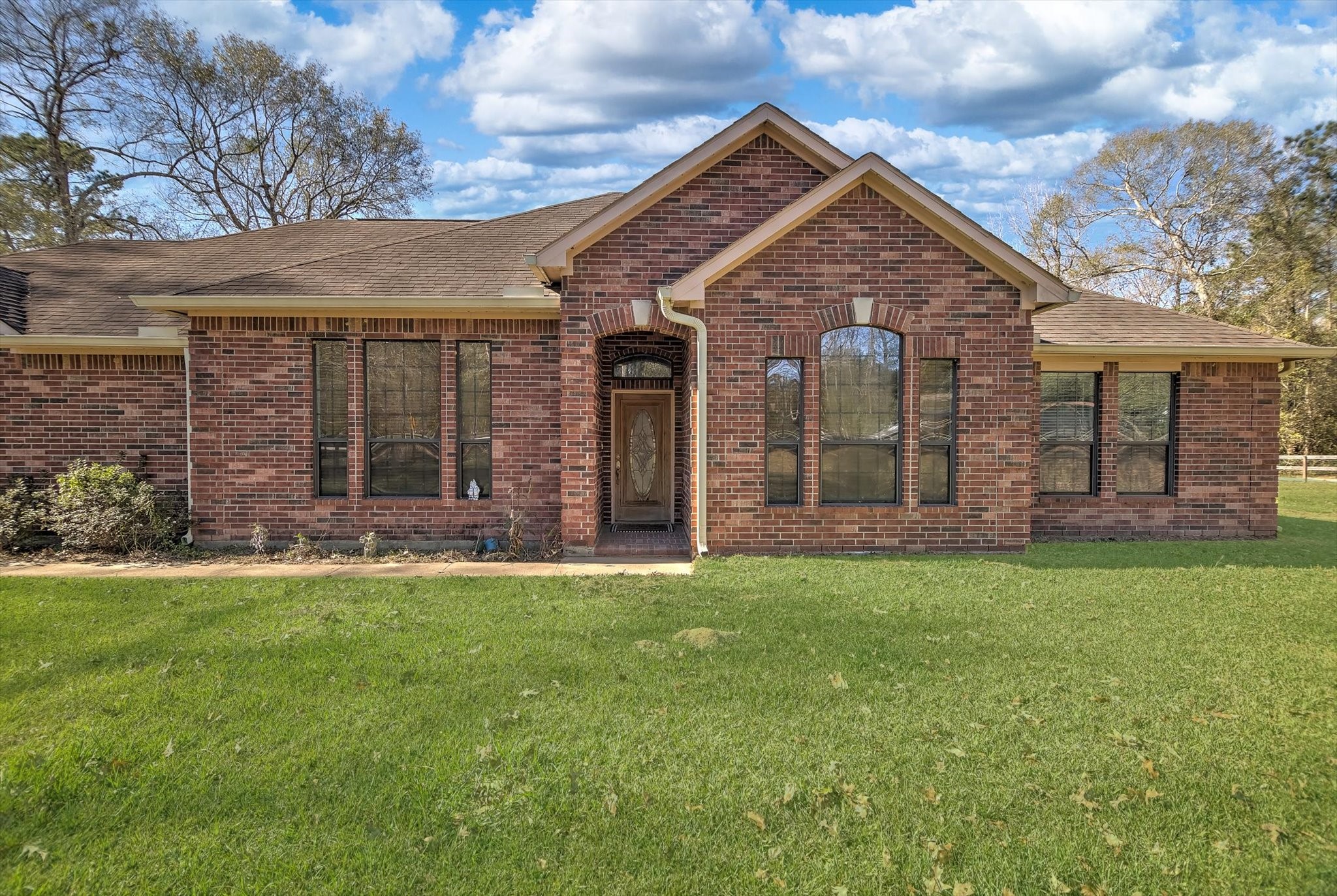 3850 Farm To Market 1010 Road Cleveland, TX 77327 - Photo 5 of 49 front view of a house with a yard