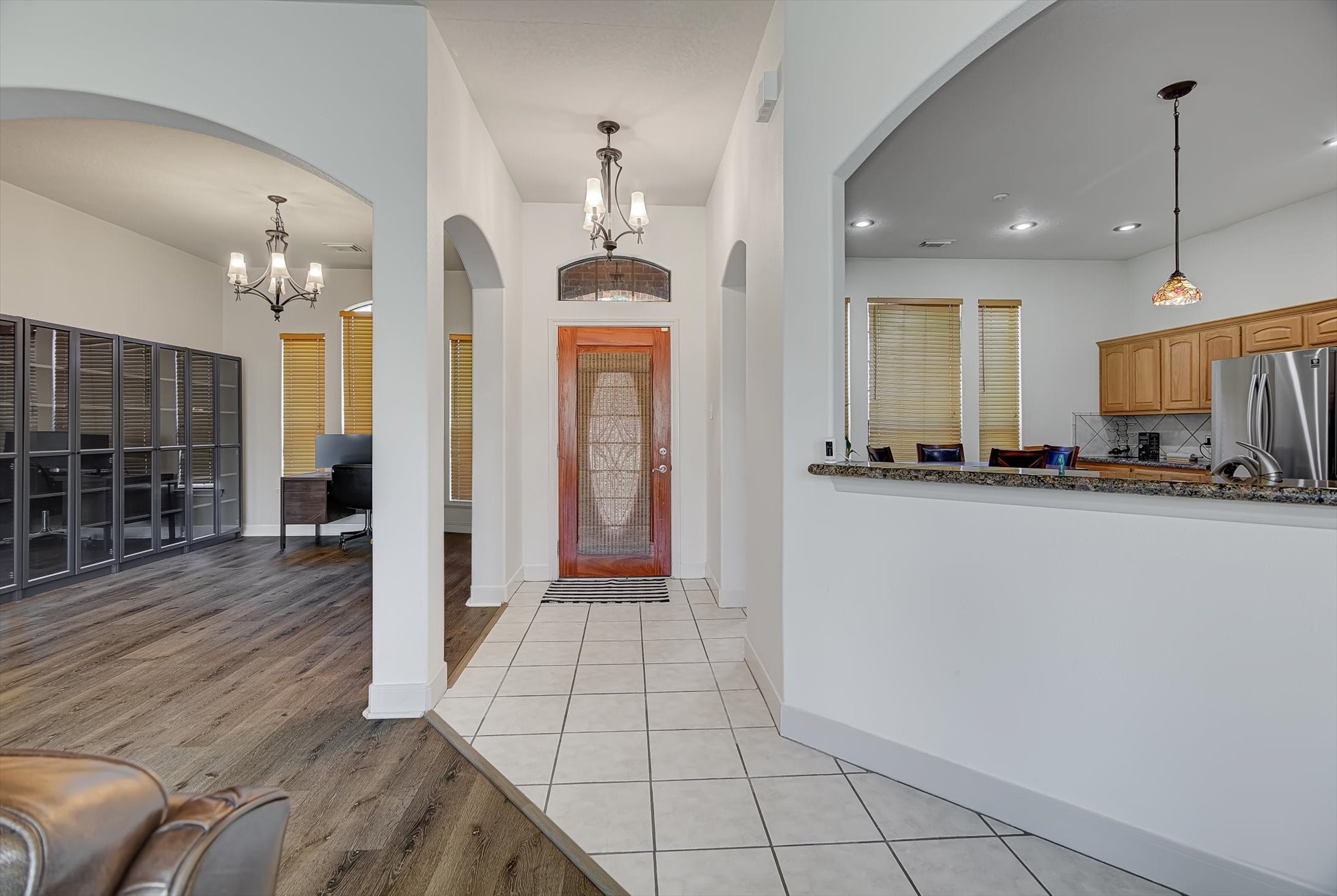 3850 Farm To Market 1010 Road Cleveland, TX 77327 - Photo 6 of 49 a view of a kitchen with refrigerator and wooden floor