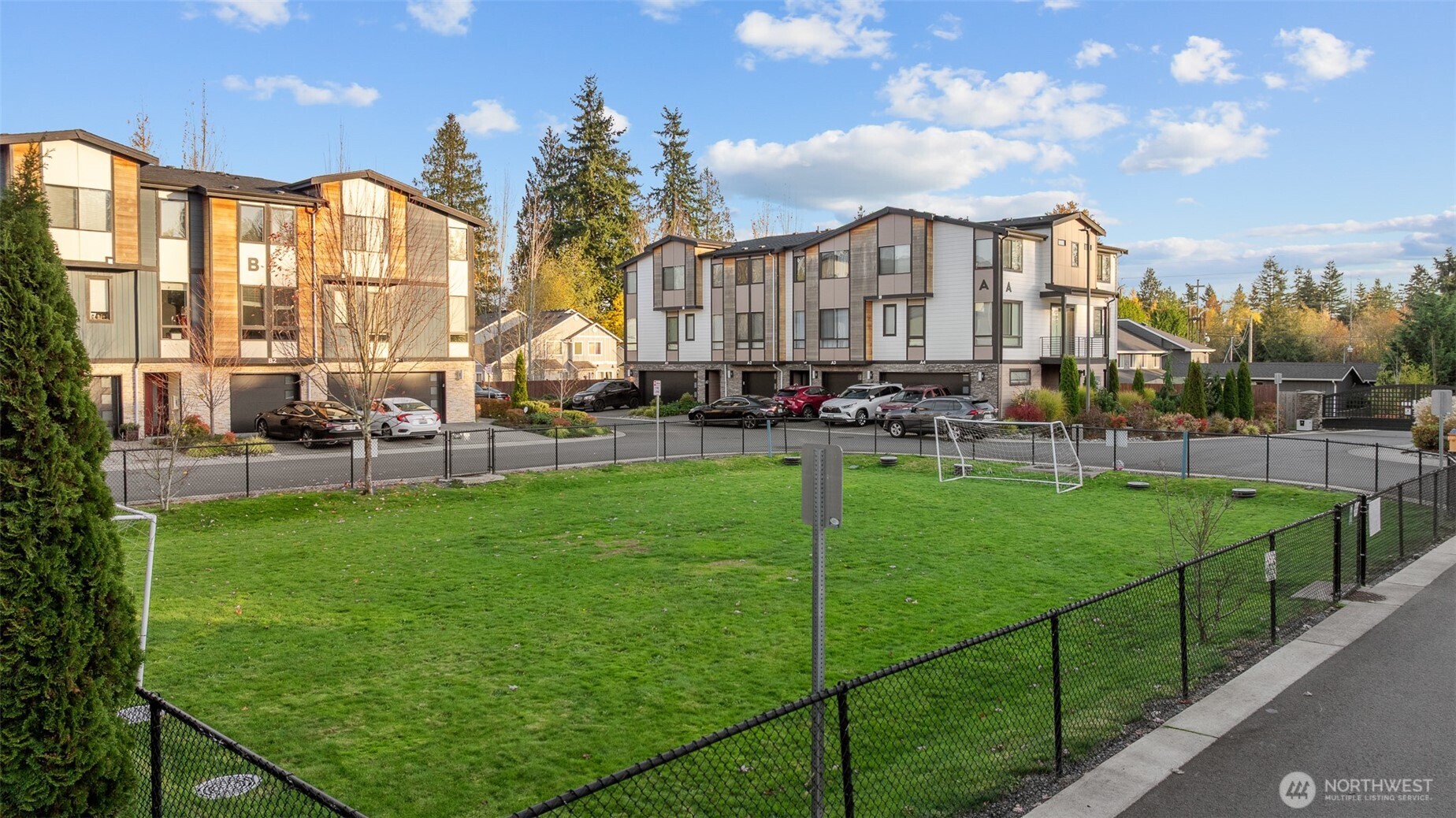 729 112th Street Southwest, Unit G1 Everett, WA 98204 - Photo 29 of 32 a view of a big yard and front view of a building