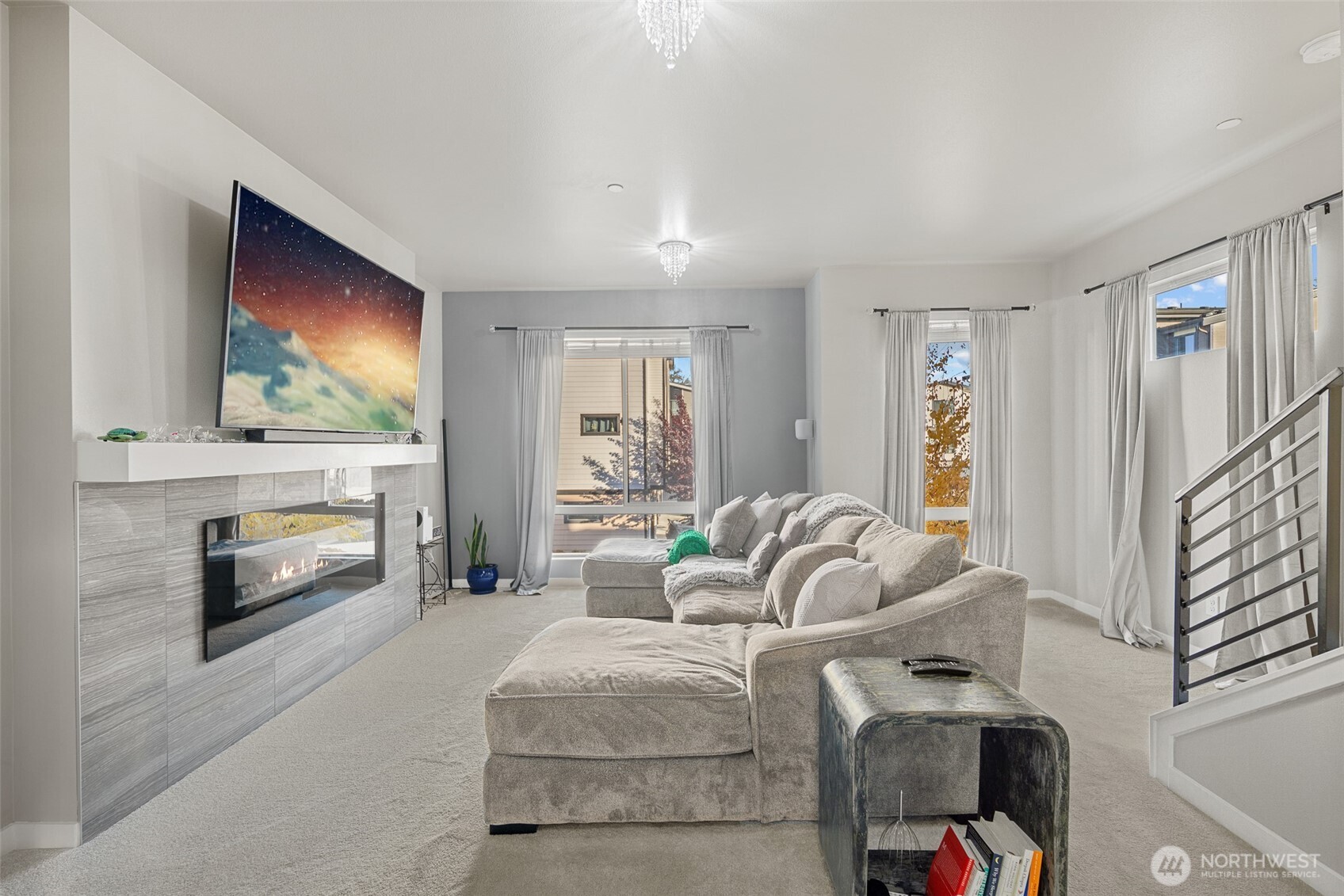 729 112th Street Southwest, Unit G1 Everett, WA 98204 - Photo 6 of 32 a living room with furniture a fireplace and a flat screen tv