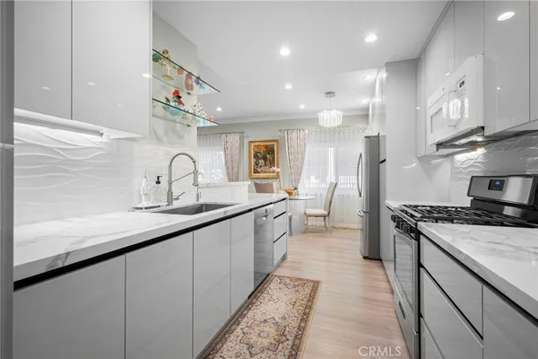 a bedroom with a bed and a night stand