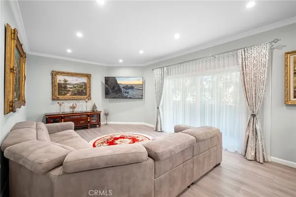 a bedroom with furniture and a painting