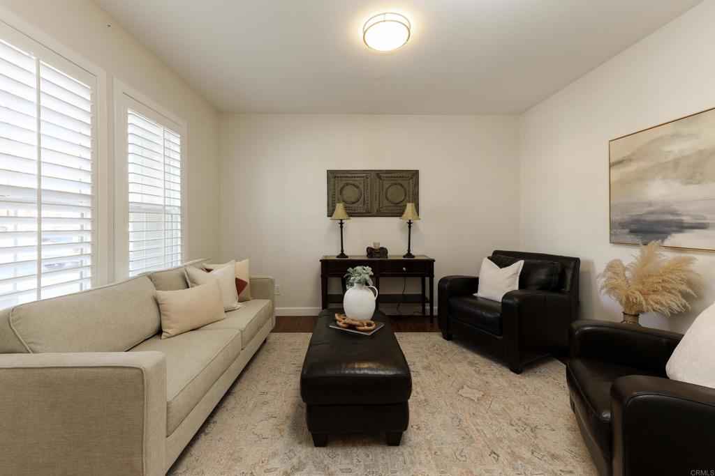 1446 Old Janal Ranch Road Chula Vista, CA 91915 - Photo 16 of 51 a living room with furniture rug and window