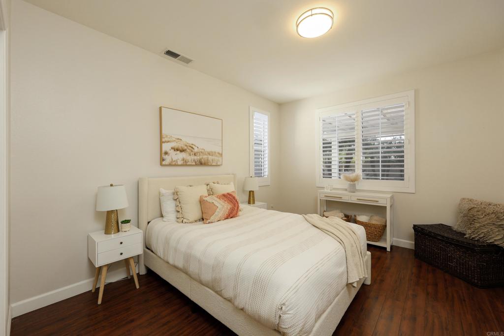 1446 Old Janal Ranch Road Chula Vista, CA 91915 - Photo 17 of 51 a bedroom with a bed and wooden floor