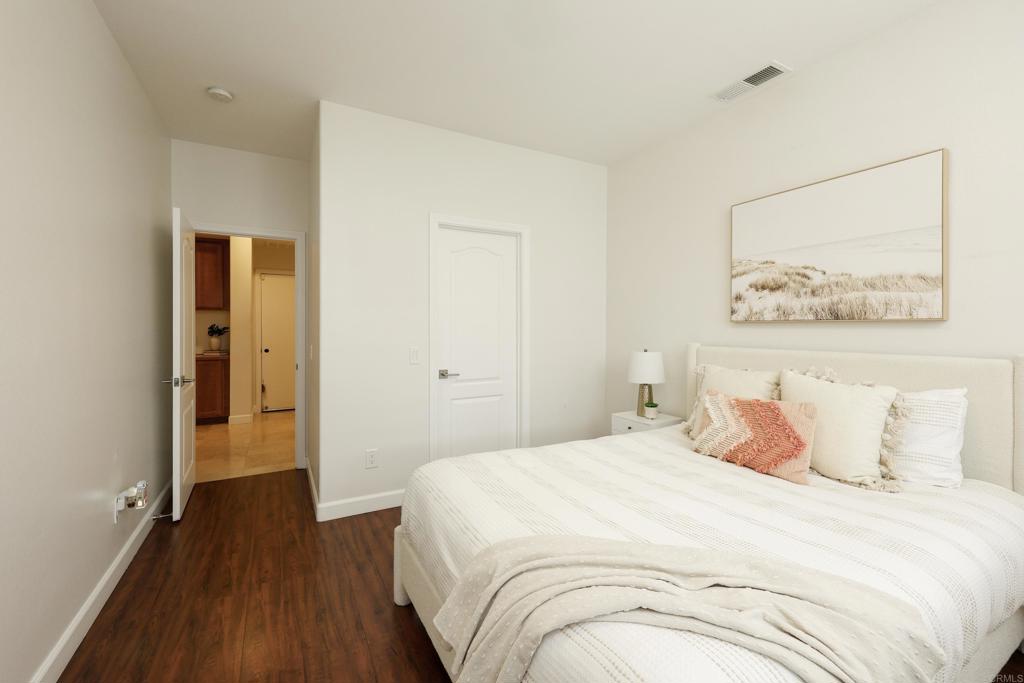 1446 Old Janal Ranch Road Chula Vista, CA 91915 - Photo 18 of 51 a bedroom with a bed and wooden floor