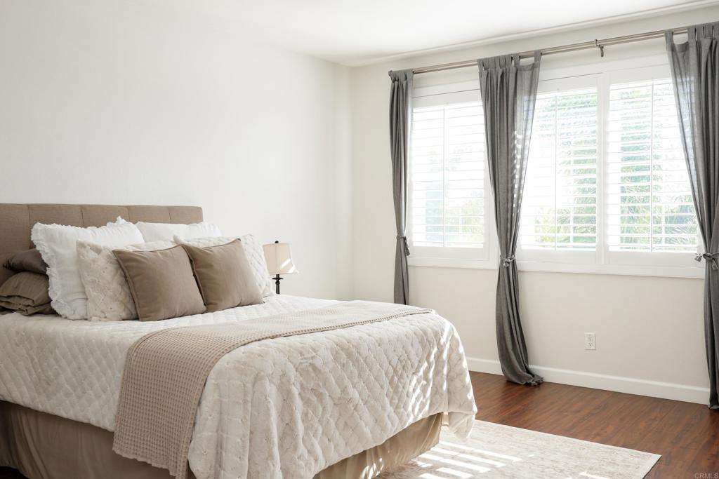 1446 Old Janal Ranch Road Chula Vista, CA 91915 - Photo 23 of 51 a bedroom with a bed and wooden floor