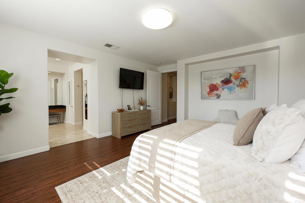 1446 Old Janal Ranch Road Chula Vista, CA 91915 - Photo 24 of 51 a bedroom with a bed and a flat screen tv