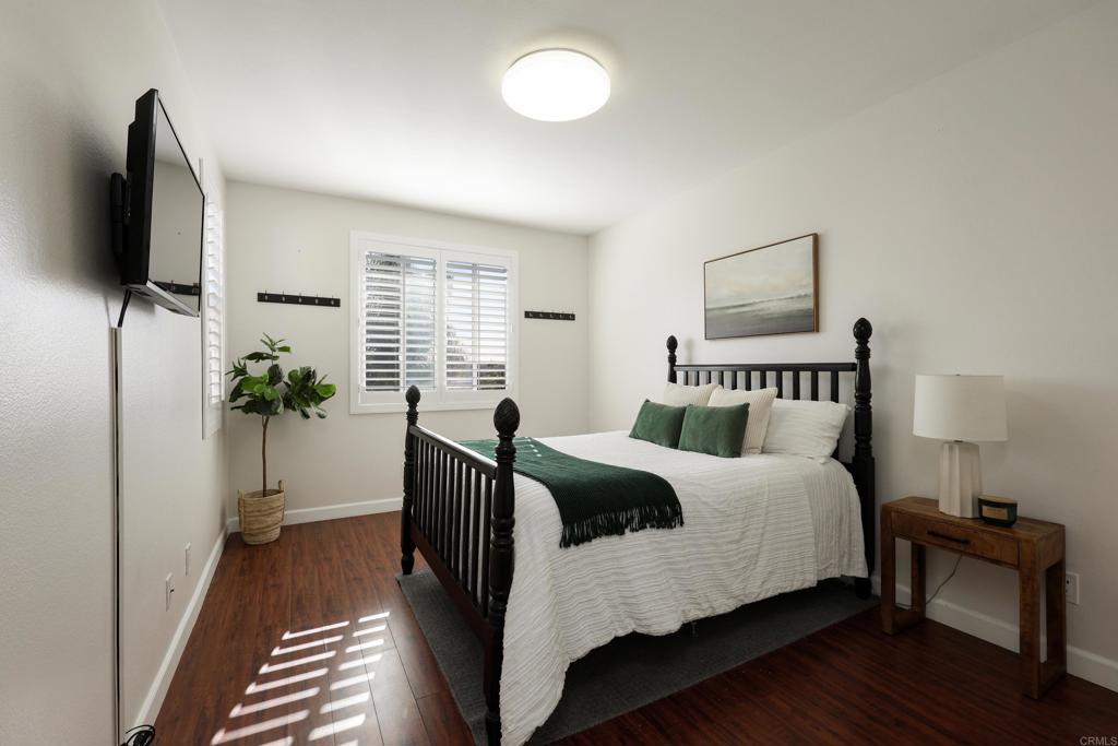1446 Old Janal Ranch Road Chula Vista, CA 91915 - Photo 29 of 51 a bedroom with a bed and a flat screen tv