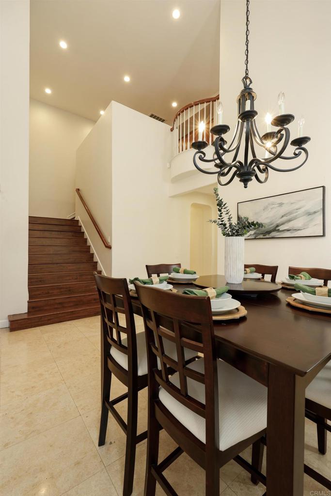 1446 Old Janal Ranch Road Chula Vista, CA 91915 - Photo 3 of 51 a view of a dining room with furniture and wooden floor