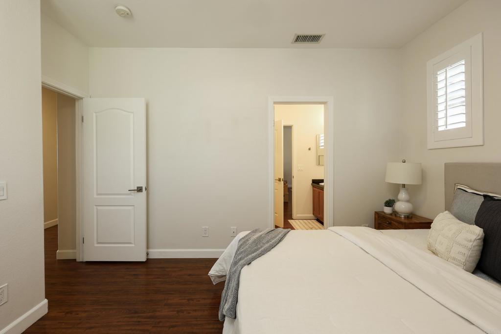 1446 Old Janal Ranch Road Chula Vista, CA 91915 - Photo 32 of 51 a bedroom with a bed and wooden floor