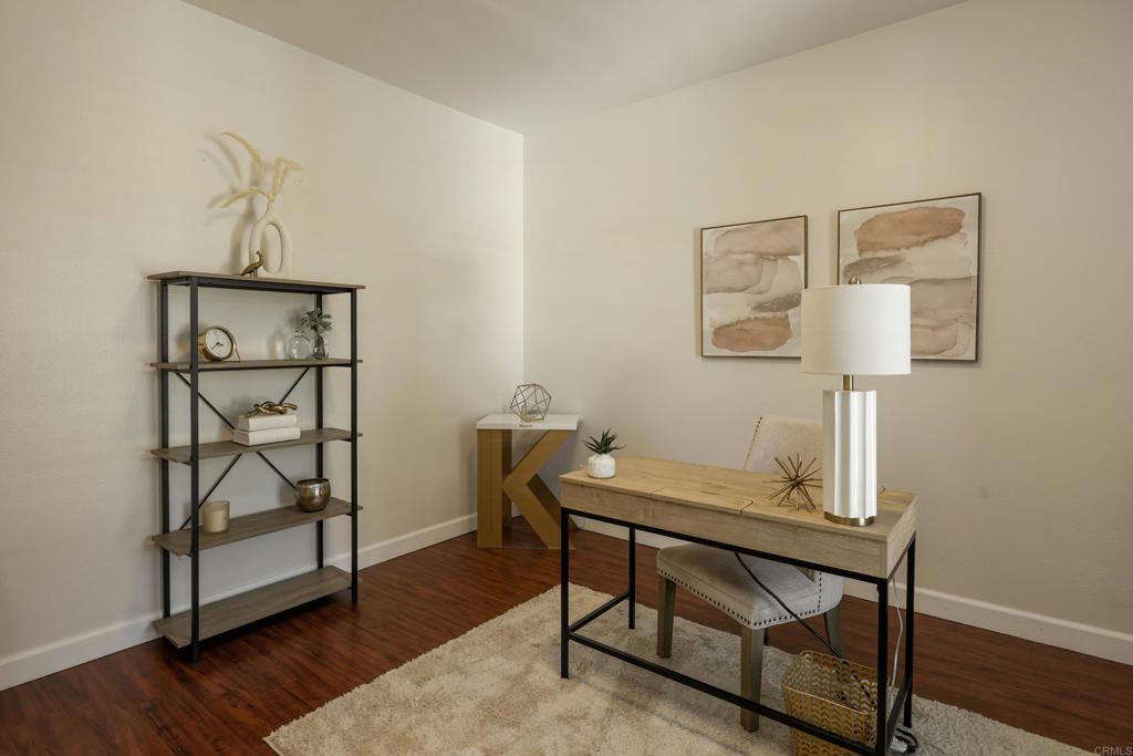 1446 Old Janal Ranch Road Chula Vista, CA 91915 - Photo 36 of 51 a view of a workspace with furniture and wooden floor