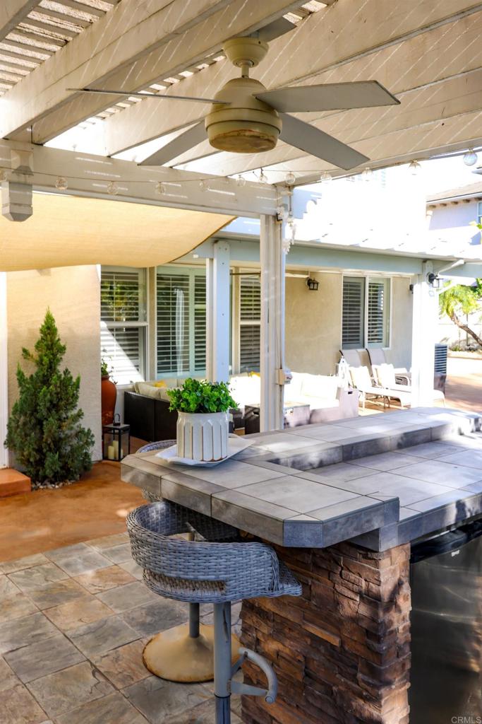 1446 Old Janal Ranch Road Chula Vista, CA 91915 - Photo 40 of 51 a view of house with backyard outdoor seating and wooden floor