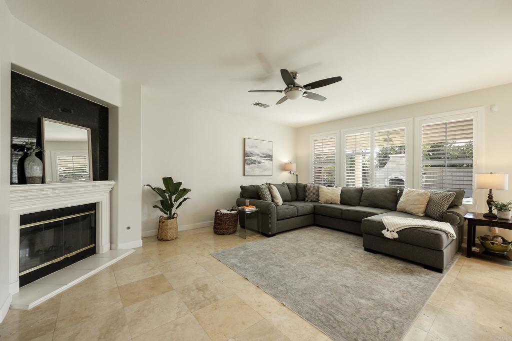 1446 Old Janal Ranch Road Chula Vista, CA 91915 - Photo 6 of 51 a living room with furniture and a fireplace
