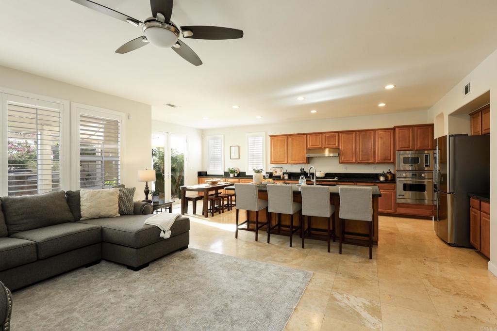 1446 Old Janal Ranch Road Chula Vista, CA 91915 - Photo 7 of 51 a living room with lots of furniture and kitchen view