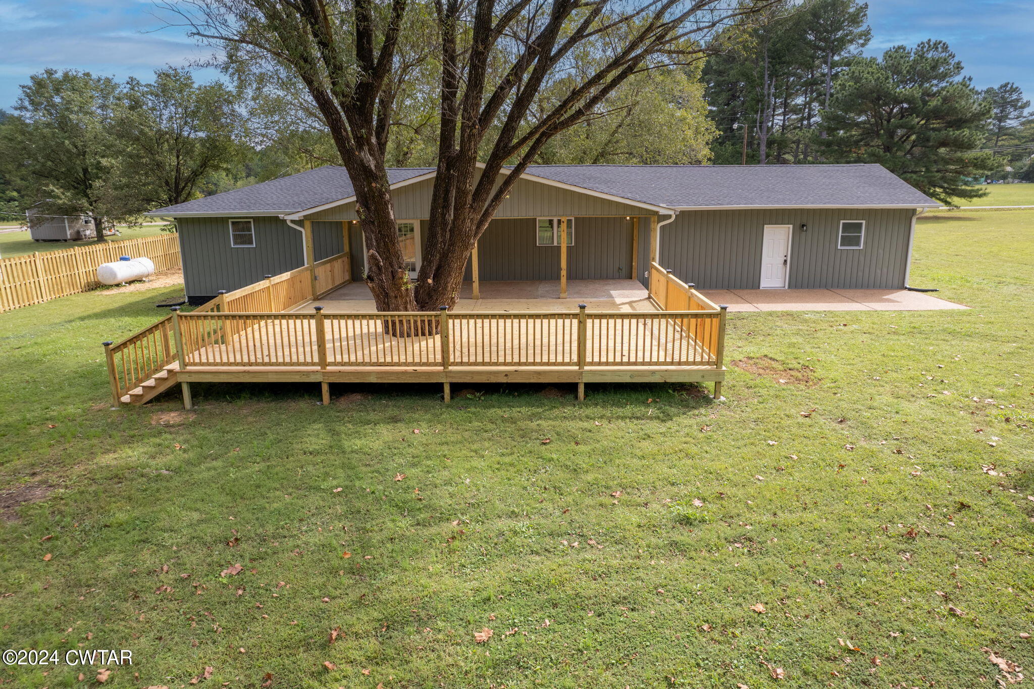 444 Diamond Grove Road Beech Bluff, TN 38313 - Photo 11 of 36 a view of a house with a backyard