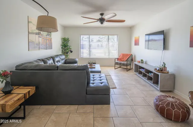 a living room with furniture and a window