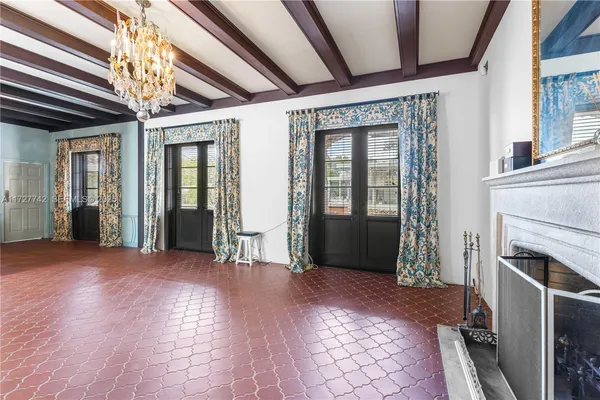 a view of entryway with furniture and chandelier