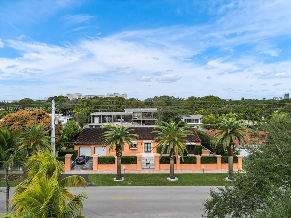 an aerial view of a residential apartment building with a yard