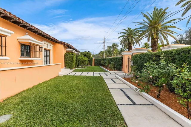 a house view with a garden space