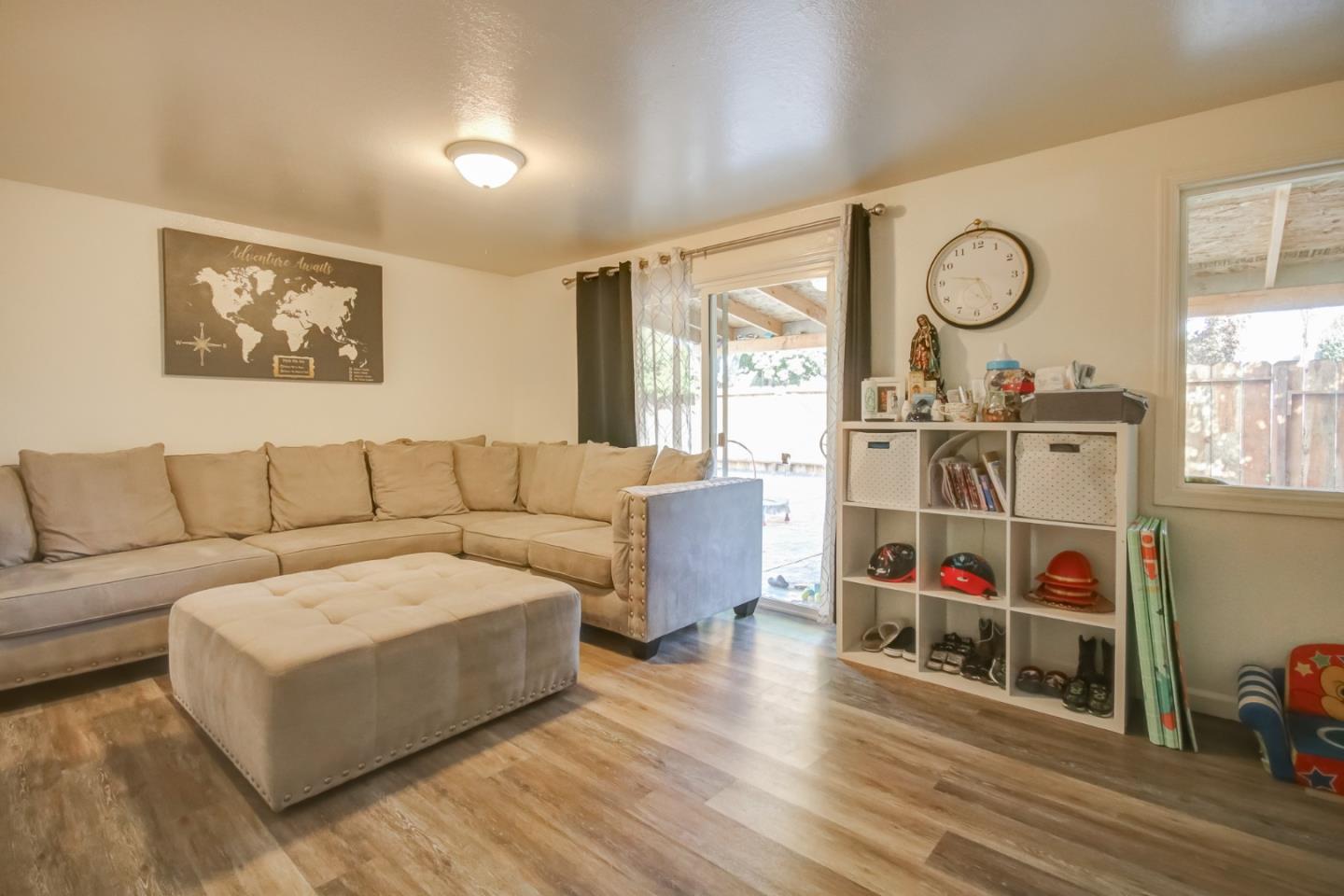 1350 San Blanco Drive Salinas, CA 93901 - Photo 13 of 22 a living room with furniture a flat screen tv and a floor to ceiling window