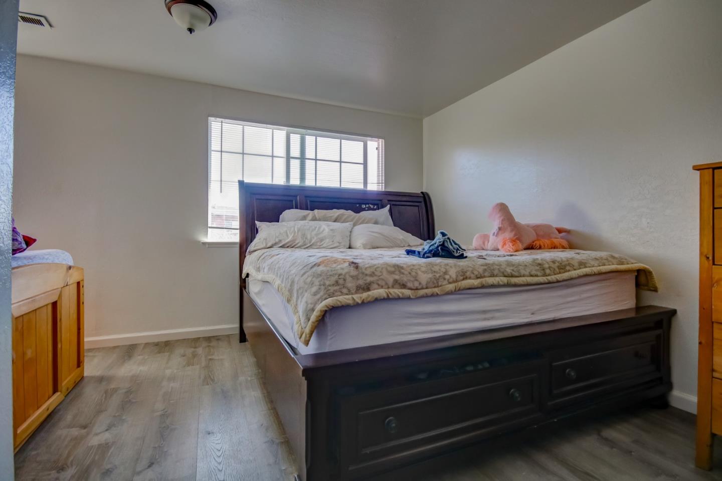 1350 San Blanco Drive Salinas, CA 93901 - Photo 15 of 22 a bedroom with a bed and wooden floor