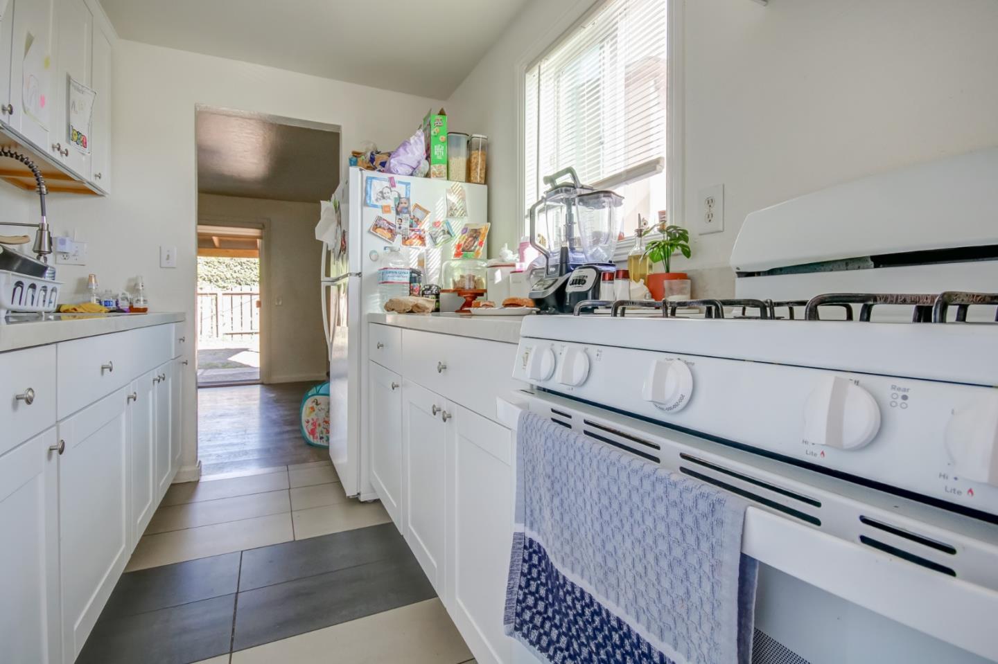 1350 San Blanco Drive Salinas, CA 93901 - Photo 20 of 22 a kitchen with stainless steel appliances a sink stove and cabinets