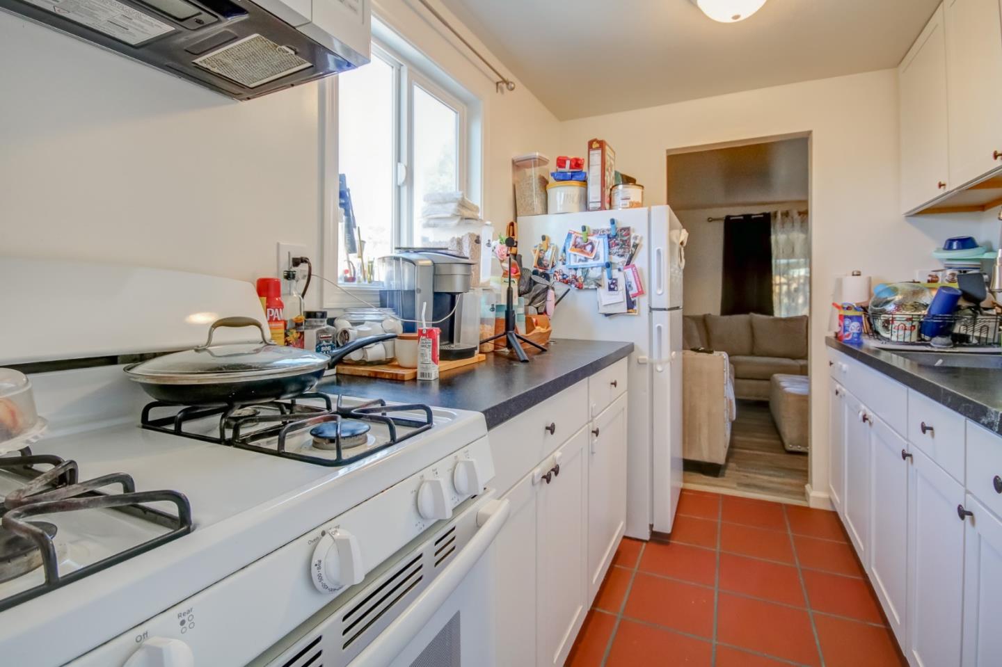 1350 San Blanco Drive Salinas, CA 93901 - Photo 9 of 22 a kitchen with stove and white cabinets