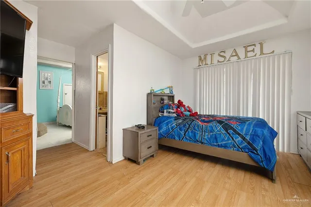 a bed room with a bed and a chair