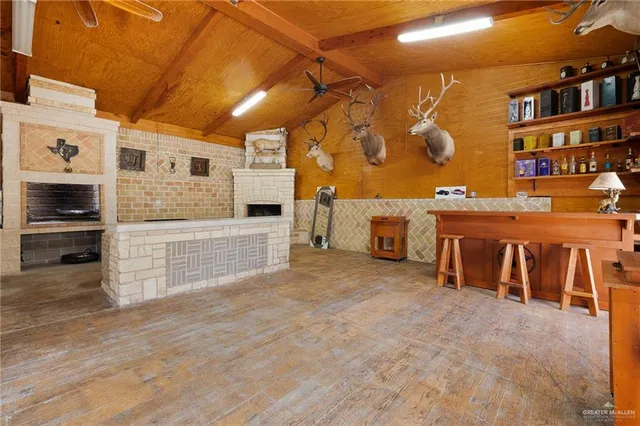 an aerial view of a house with a yard and garden